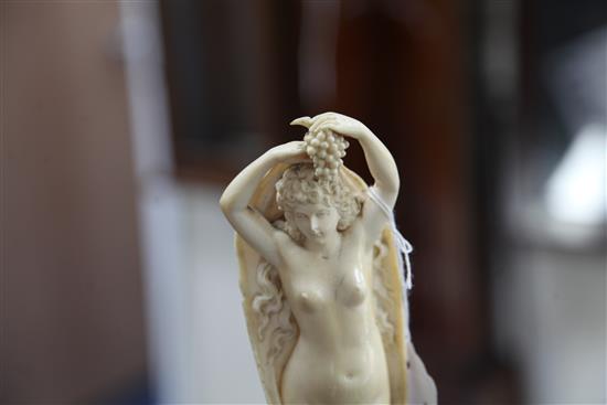 A pair of 19th century Dieppe ivory carvings of muses, Overall H. 12.25in.